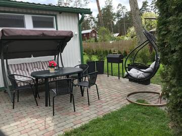 Фото номера Дом с 2 спальнями Дома для отпуска River Side House г. Vārnu Krogs 75